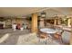 Spacious outdoor lounge with multiple seating areas and elegant lighting fixtures at 521 Mandalay Ave # 307, Clearwater Beach, FL 33767