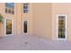 Outdoor patio with tile flooring and glass doors leading to the inside of the property at 521 Mandalay Ave # 307, Clearwater Beach, FL 33767