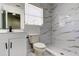 Bathroom with white tiles, a white vanity, and walk-in shower at 5435 Birchwood Rd, Spring Hill, FL 34608
