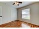 Bedroom with wood-look floors, a window, and a closet at 5435 Birchwood Rd, Spring Hill, FL 34608