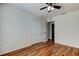 Bedroom features wood floors, a ceiling fan and a closet at 5435 Birchwood Rd, Spring Hill, FL 34608
