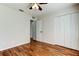 Bedroom with wood-look floors, closet, and doorway at 5435 Birchwood Rd, Spring Hill, FL 34608
