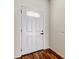 Elegant front door featuring a decorative window pane, complemented by wood-look flooring at 5435 Birchwood Rd, Spring Hill, FL 34608