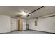 Spacious two car garage with utility closet, water heater, and extra storage cabinet at 5435 Birchwood Rd, Spring Hill, FL 34608
