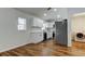 Modern kitchen equipped with white cabinets, sleek appliances, and stylish wood-look flooring at 5435 Birchwood Rd, Spring Hill, FL 34608