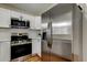 Modern kitchen featuring stainless steel appliances, gas range, and ample storage space at 5435 Birchwood Rd, Spring Hill, FL 34608