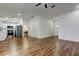 Inviting living area featuring wood-look flooring, seamlessly connecting to the modern kitchen and other living spaces at 5435 Birchwood Rd, Spring Hill, FL 34608