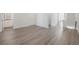 Bedroom leading to a bathroom, closet and staircase, featuring hard flooring at 5530 N 9Th St # 6, Tampa, FL 33604