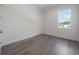Bright bedroom showcasing wood flooring and a large window at 5530 N 9Th St # 6, Tampa, FL 33604