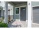 Beautiful townhome showcasing a private garage, covered front entry and stylish architectural details at 5530 N 9Th St # 6, Tampa, FL 33604