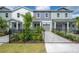 Stylish townhomes featuring manicured landscaping, a private garage and a fenced yard at 5530 N 9Th St # 6, Tampa, FL 33604