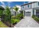 Charming townhome featuring a private garage, meticulously landscaped yard and paver driveway at 5530 N 9Th St # 6, Tampa, FL 33604