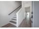 Inviting foyer featuring sleek flooring, staircase, and an open view into the expansive living space at 5530 N 9Th St # 6, Tampa, FL 33604