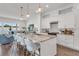 The kitchen island is the perfect gathering place with it's marble countertops and a modern open floor plan at 5530 N 9Th St # 6, Tampa, FL 33604