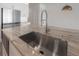 Granite countertop with stainless steel sink and pull down faucet in bright kitchen at 5530 N 9Th St # 6, Tampa, FL 33604