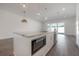 Bright, open kitchen featuring an island, stainless steel appliances, and abundant natural light at 5530 N 9Th St # 6, Tampa, FL 33604