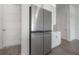 Stainless steel refrigerator stands out among white cabinetry and a stylish countertop in this kitchen view at 5530 N 9Th St # 6, Tampa, FL 33604
