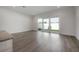 Open living area with sliding glass doors offering access to the outdoor space and natural light at 5530 N 9Th St # 6, Tampa, FL 33604