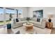 Comfortable living room with a sectional sofa, rug, and a view of the fenced-in yard at 5530 N 9Th St # 6, Tampa, FL 33604