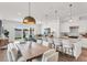 Bright living spaces with modern finishes feature an open floorplan with a dining area, living room, and kitchen at 5530 N 9Th St # 6, Tampa, FL 33604