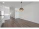 Bright, open-concept living space featuring sleek flooring, and modern design at 5530 N 9Th St # 6, Tampa, FL 33604