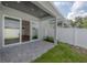 Covered patio with view of the house interior through sliding glass doors at 5530 N 9Th St # 6, Tampa, FL 33604