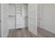 Walk-in closet with custom shelving and wood flooring at 5530 N 9Th St # 6, Tampa, FL 33604