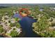 Panoramic aerial view of a stunning lake community surrounded by lush greenery and serene waters at 5720 Half Moon Lake Rd, Tampa, FL 33625