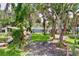 Charming home nestled among mature trees with a lush green backyard and easy access to the waterfront at 5720 Half Moon Lake Rd, Tampa, FL 33625