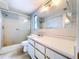 Bathroom featuring a walk-in shower and vanity at 5720 Half Moon Lake Rd, Tampa, FL 33625