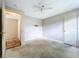Spacious bedroom featuring neutral walls, ceiling fan and a doorway leading to another room at 5720 Half Moon Lake Rd, Tampa, FL 33625