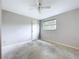 Bedroom with ceiling fan, closet, and natural light at 5720 Half Moon Lake Rd, Tampa, FL 33625