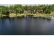 Scenic view of a lake with homes nestled among lush trees along the shoreline at 5720 Half Moon Lake Rd, Tampa, FL 33625
