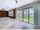 Bright open living area, tile floors, with sliding doors to backyard at 5720 Half Moon Lake Rd, Tampa, FL 33625