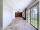 Bright open living area, tile floors, with sliding doors to the back yard at 5720 Half Moon Lake Rd, Tampa, FL 33625