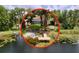 Charming waterfront home featuring a private dock and lush landscaping, perfect for lakeside living and enjoying nature at 5720 Half Moon Lake Rd, Tampa, FL 33625