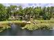 Gorgeous waterfront home with a private dock, surrounded by lush trees and serene lake views, perfect for peaceful living at 5720 Half Moon Lake Rd, Tampa, FL 33625