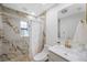 Elegant bathroom featuring stylish gold fixtures and a walk-in shower at 5933 Carina Trce, Wesley Chapel, FL 33545
