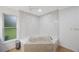 Beautiful bathroom features a soaking tub and modern finishes at 5933 Carina Trce, Wesley Chapel, FL 33545