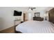 Comfortable main bedroom features modern furnishings and a ceiling fan at 5933 Carina Trce, Wesley Chapel, FL 33545