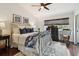 This bedroom has a metal bed frame and dark wood floors at 6109 Bayside Key Dr, Tampa, FL 33615