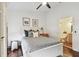 This bright bedroom features an en-suite bathroom and ceiling fan at 6109 Bayside Key Dr, Tampa, FL 33615