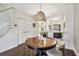 Inviting dining area features a wooden table, stylish chairs, and a unique pendant light fixture at 6109 Bayside Key Dr, Tampa, FL 33615