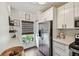 Bright kitchen featuring stainless steel appliances and white cabinets at 6109 Bayside Key Dr, Tampa, FL 33615