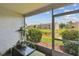 View of lush landscaping and pond from screened lanai at 6109 Bayside Key Dr, Tampa, FL 33615