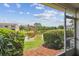 The lanai has a view of the pond and surrounding greenery at 6109 Bayside Key Dr, Tampa, FL 33615
