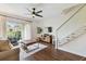 Cozy living room features a ceiling fan, comfortable furniture, and lots of natural light at 6109 Bayside Key Dr, Tampa, FL 33615