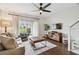 Inviting living room boasts a large sliding glass door for natural light and seamless outdoor access at 6109 Bayside Key Dr, Tampa, FL 33615