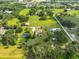 Beautiful home with fenced yard and mature trees, surrounded by acres of verdant countryside at 611 Robinson Oaks Ln, Plant City, FL 33567