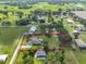 An aerial view of the property with a highlighted boundary line and surrounding green landscape at 611 Robinson Oaks Ln, Plant City, FL 33567